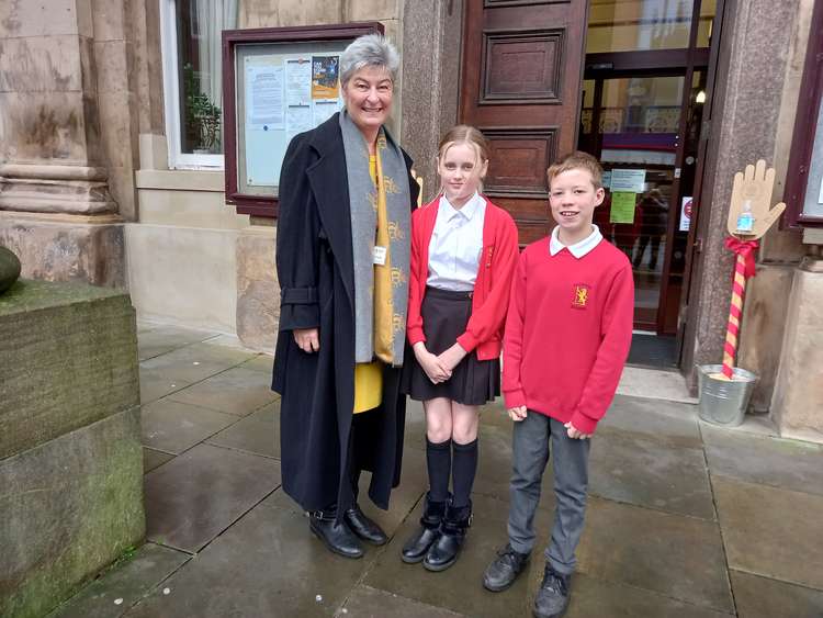 Knutsford primary school pupils Brooke McAteer and Ben Ormerod outside Macclesfield Town Hall on Market Place, with headteacher Alison Hooper after giving a speech at Cheshire East's highways and transport committee.