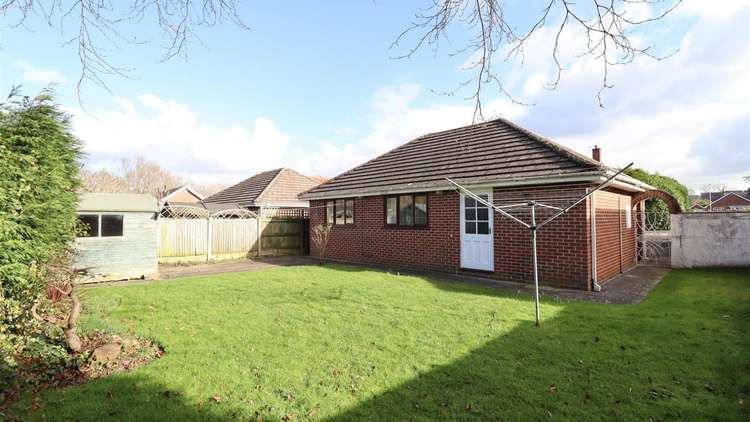 The rear of the bungalow has plenty of garden space, which is great for hosting guests or growing plants.