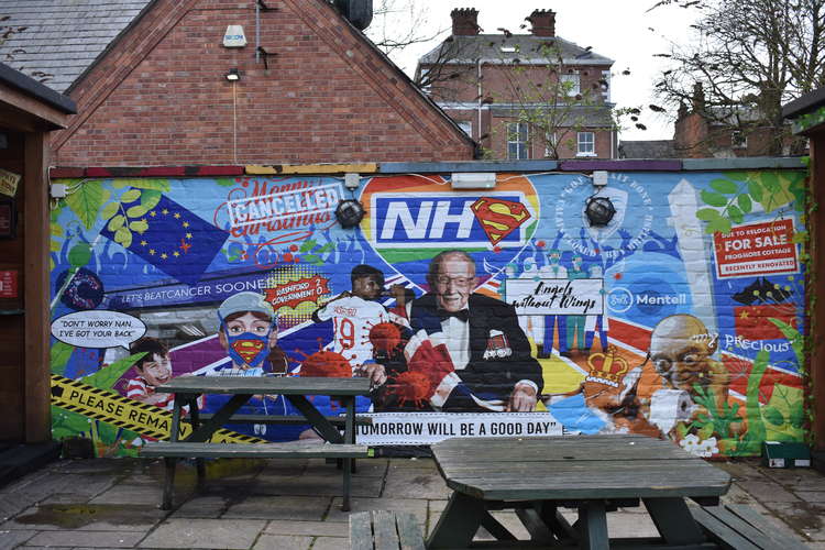 A colourful mural at the Mill Street pub highlights the recent past.