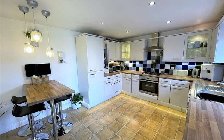 The breakfast kitchen leads out to one of the reception rooms, and has garden views.