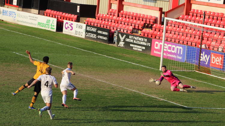 Ex-Bolton Wanderers goalie Sam Ashton (36) fends off a final effort from Congleton Town.