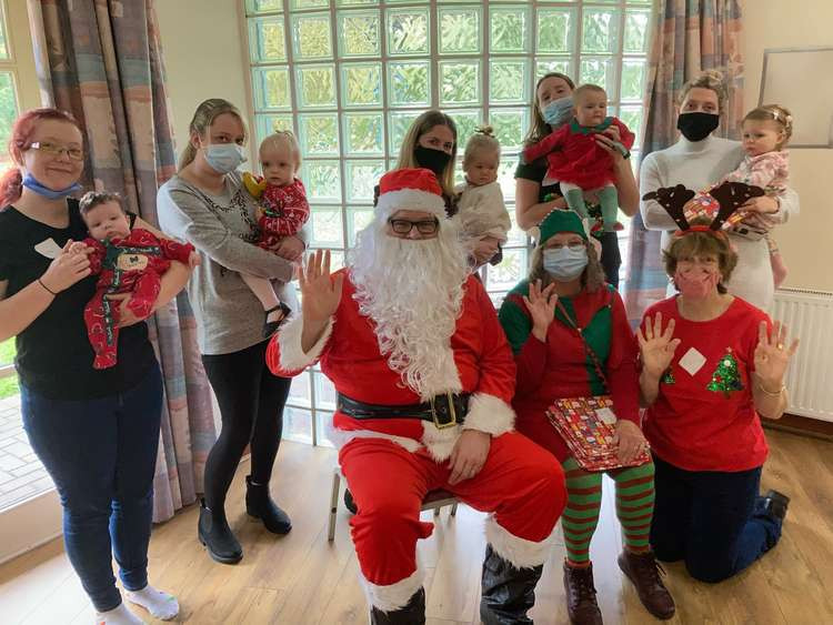 Father Christmas visiting the Cygnets parent and baby group. Credit: Roots Community Enhancement