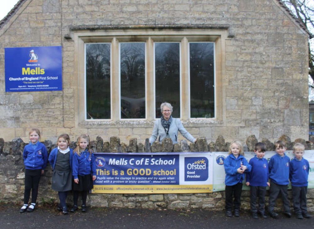 Claire Chantler, Executive Headteacher, celebrates Mells CofE First School's recent Ofsted result with pupils from this year's reception class