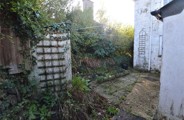 Route into the courtyard garden. Bradleys Estate Agents.