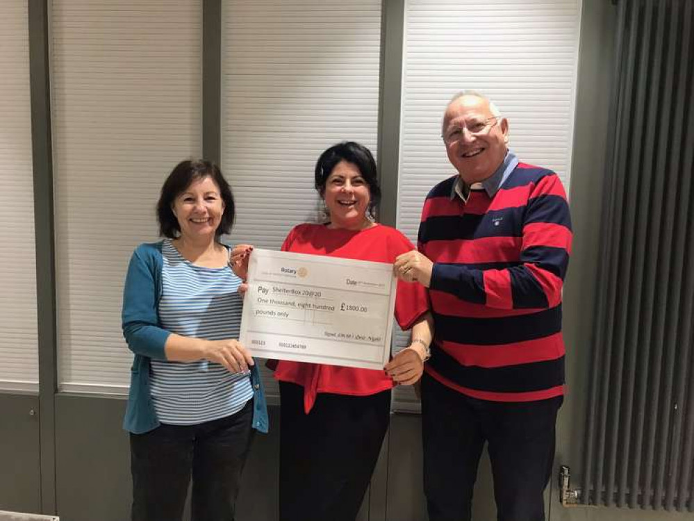 Tilehouse members Bob Harris and Susan Downie accept a cheque from Lucia Melillo of Lucia Hair and Beauty