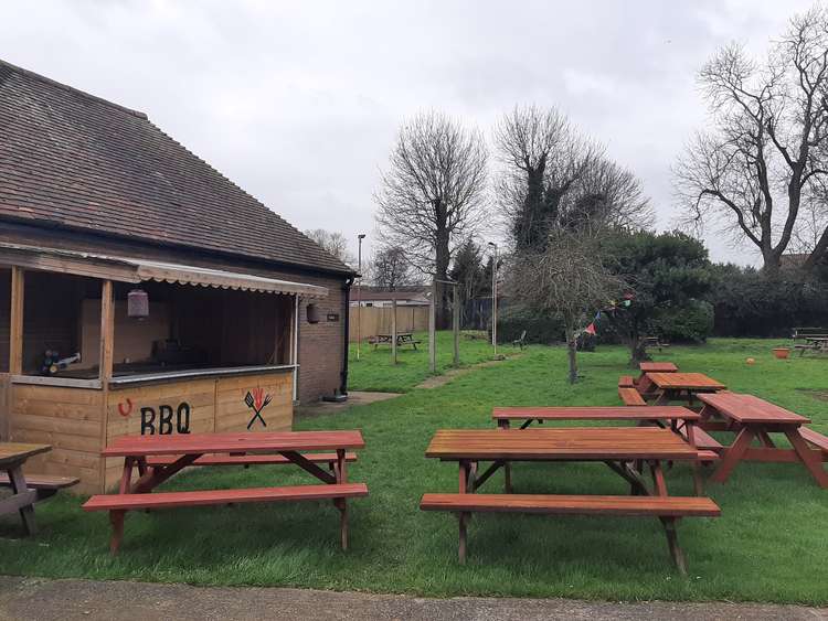 The BBQ hut and spacious play area at the Bird in Hand