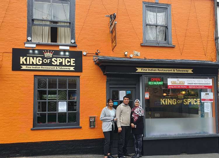 King of Spice's owner and family outside the restaurant