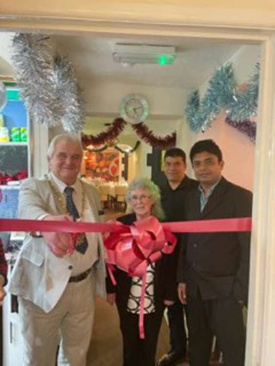 Mayor John Zarczynski, Deputy Mayor Carol Gilson, Jaffer Sheikh and business partner Raju Islam.