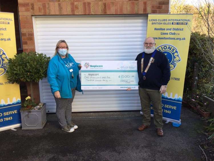 The Chairman of the Honiton Lions Club giving a cheque to Hospiscare's Community Fundraiser Toni Hiscocks. Credit: Hospiscare