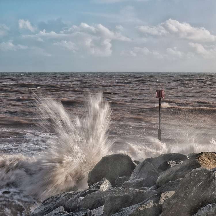 Waves on Sidmouth beach. Credit: John Davis