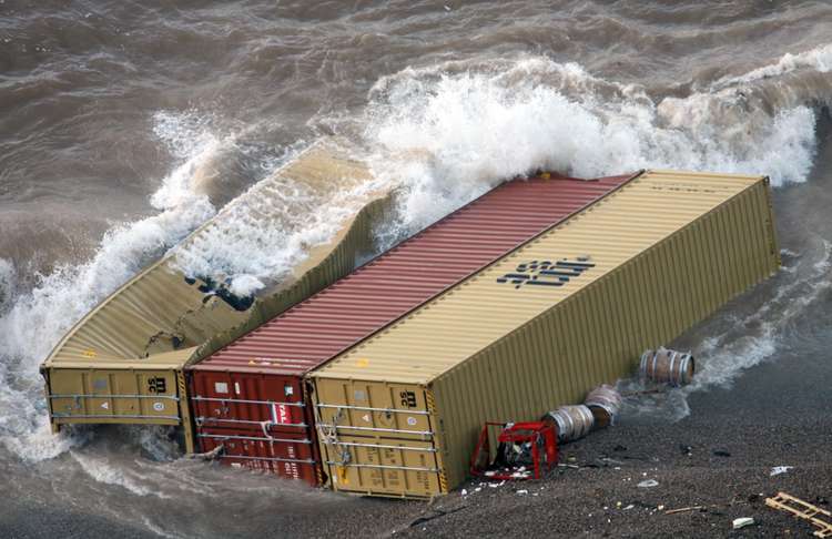 Huge cargo containers washed up on the shore (photo by Richard Austin)