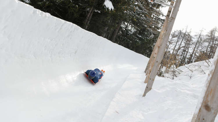 Marcus sliding through 'Wall' Corner in St. Moritz, Switzerland. Credit: Rekords