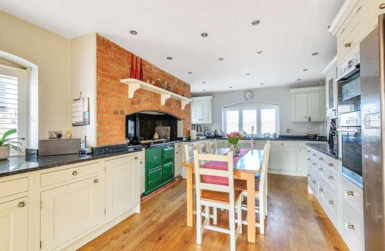 The kitchen features an Aga and it has plenty of space for a table. Credit: Bradleys Honiton.