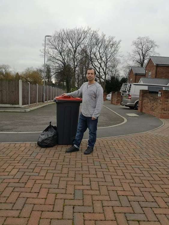 Councillor Lee Waters prepares his extra bag of rubbish. Photo credit: Alexander Waters.