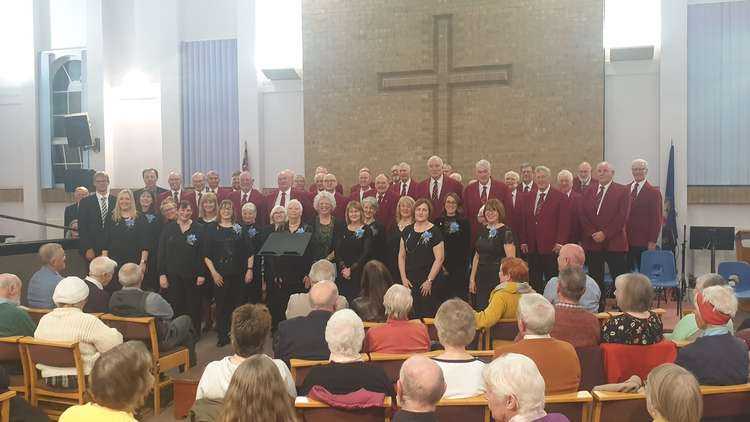 Both choirs pose for photographs at the end of the evening which saw £1300 raised for charity. Photo courtesy of Deborah Howley.
