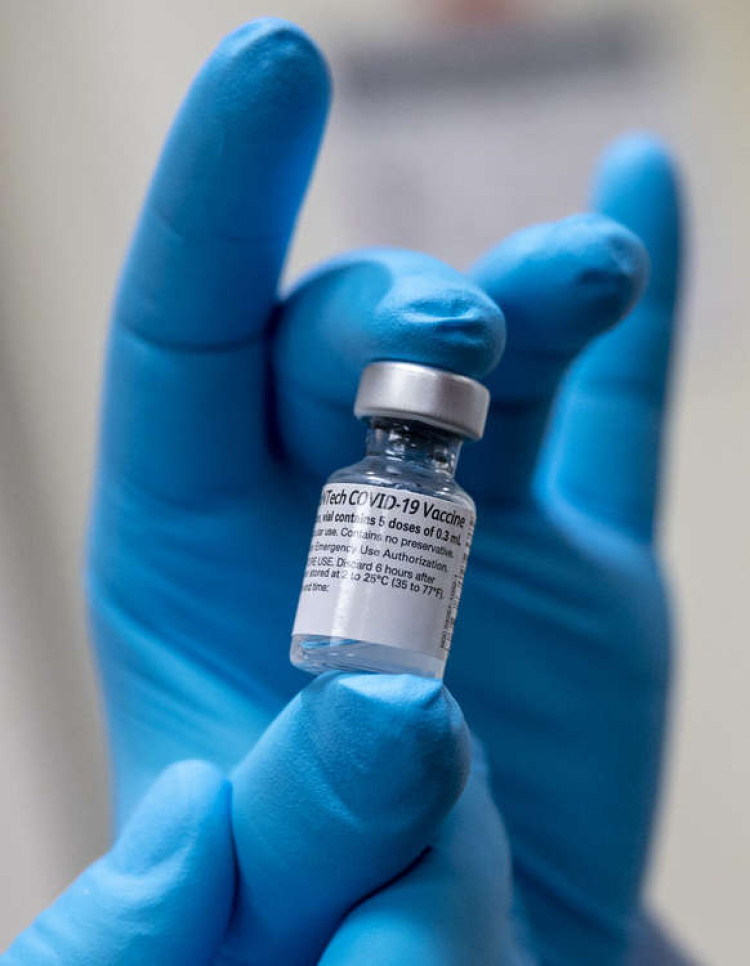 The spring booster programme opened in Nottinghamshire today. Pictured: Angel Laureano holds a vial of the COVID-19 vaccine. (DoD photo by Lisa Ferdinando). Original: https://www.flickr.com/photos/secdef/50721647742/