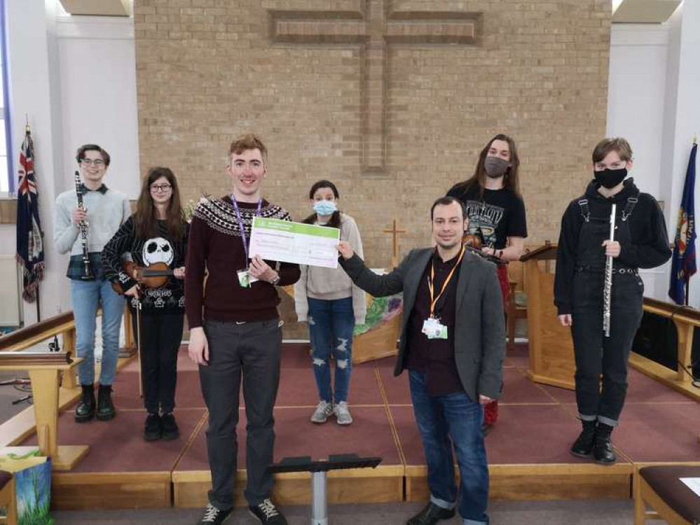 The Torkard Ensemble was formed in 2010 and received a timely financial boost thanks to the £350 donation.  Pictured: Councillor Lee Waters presents a cheque for £350 to members of the Torkard Academy. Photo courtesy of Ashfield Independents.