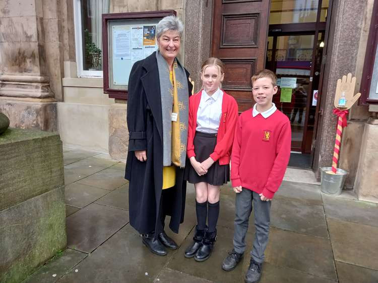 Knutsford schoolchildren Ben Ormerod and Brooke McAteer outside Macclesfield Town Hall on Market Place, with headteacher Alison Hooper after giving a speech at Cheshire East's highways and transport committee.