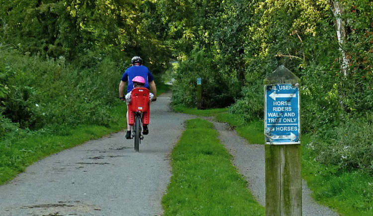 Would you like to see more cycle lanes and trails in Macclesfield? Pictured is a family cycling in the Macclesfield parliamentary constituency town of Poynton, on the Middlewood Way. © Copyright Roger Kidd / CC 2.0 Cropped bit.ly/3cFfw05