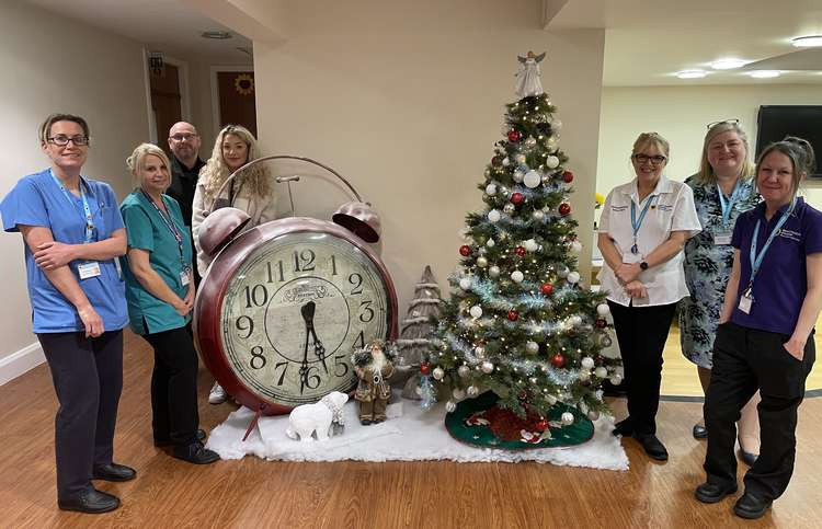 Scott Hulme and Megan Jones (third from far left) of Macclesfield business Abbey Festive Decor, have generously given East Cheshire Hospice the gift of decorations this Christmas.