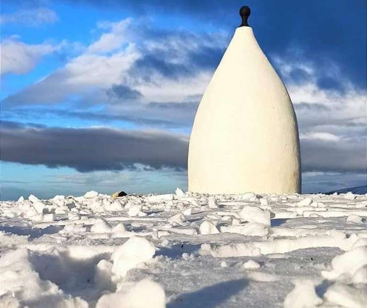 Bollington's White Nancy is true to its name at the weekend, with so much snow surrounding, it resembled and iceberg. (Image - Victoria McCarthy)