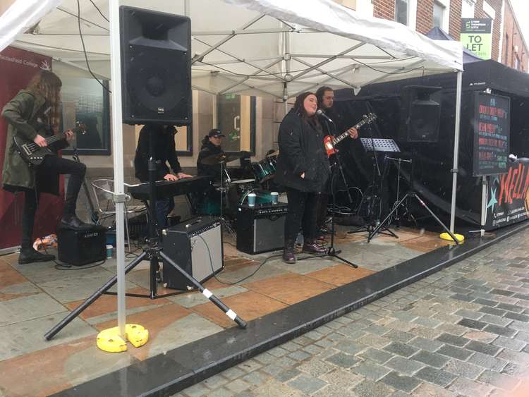 Castle Street saw the debut of the Macclesfield College Stage, with these youngsters unpeturbed by the weather to rock a raucous rendition of Journey's song 'Don't Stop Believin''.