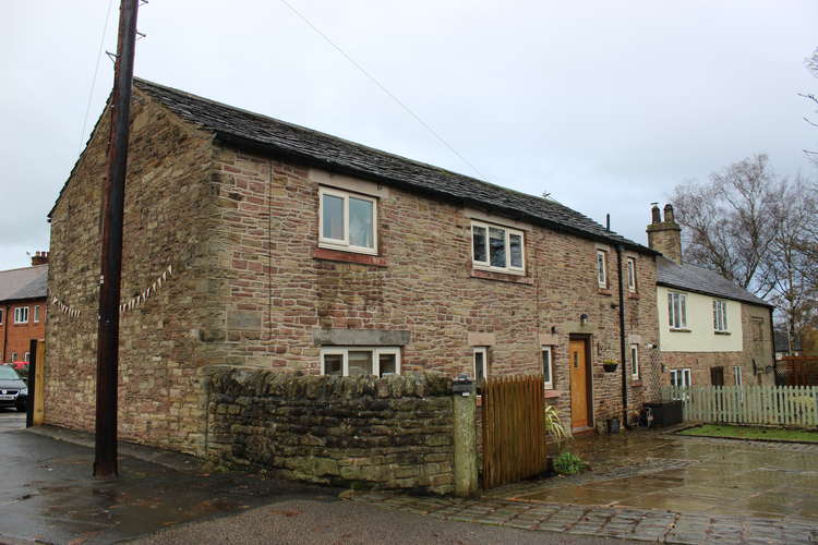 The converted barn house called Tunnicliffe Cottage (left) and the Tunnicliffe's old house (right). A pig sty and apple orchard also used to be at the building in Charles' time.