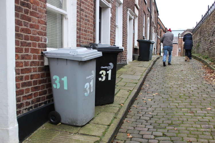 A household waste and recycling bin ready for collection on Churchside in Macclesfield town centre.