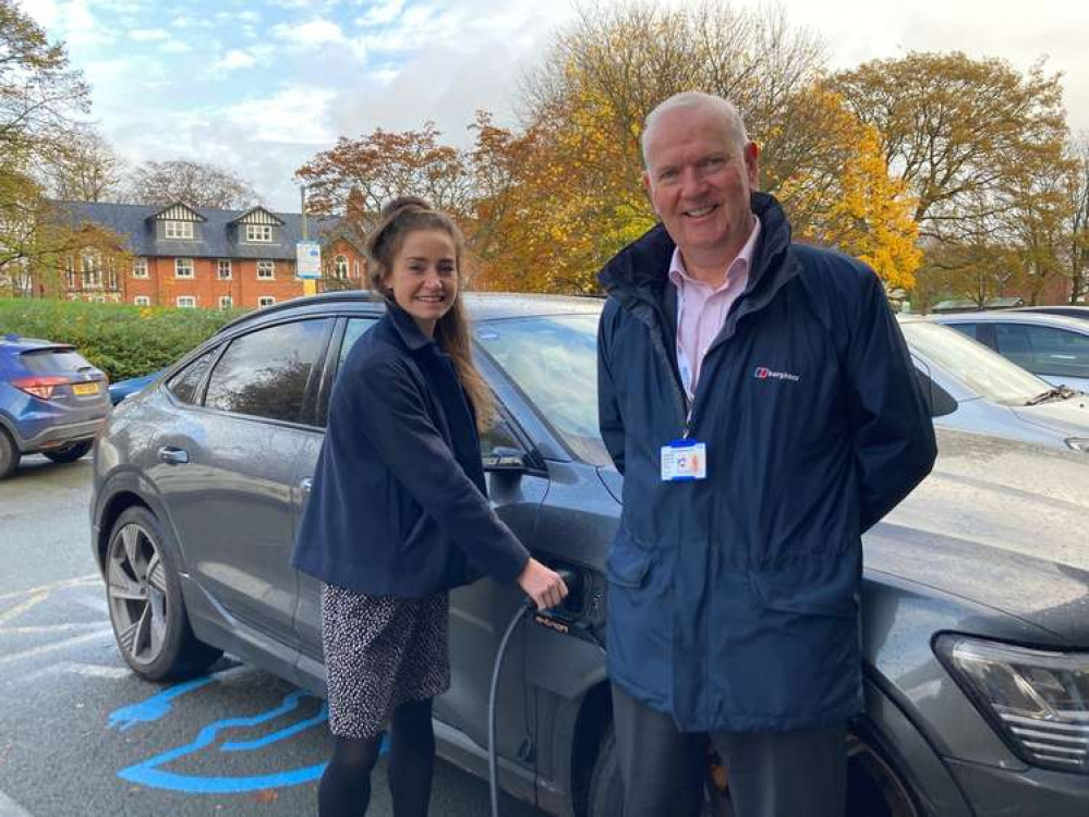 Ged Murphy and Sarah Bloor try out the new electric car charger at Macclesfield Hospital.