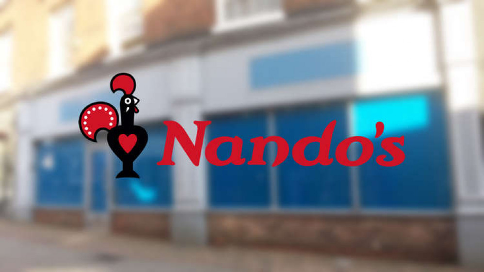 The Nando's logo behind an empty retail unit in our town. Please note: no buildings have been earmarked for Nando's. This is purely for illustrative purposes only. (Logo - Nando's)