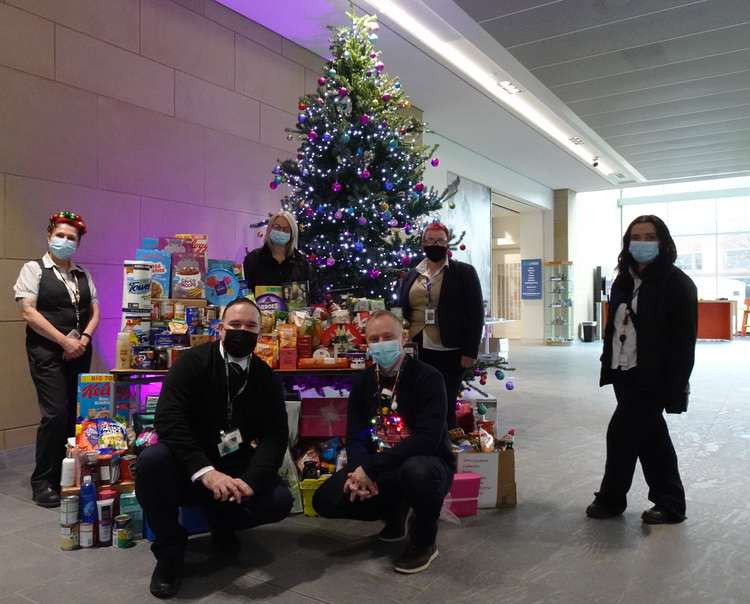 GIVING BACK: AstraZeneca Macclesfield's Chris Maddock (front left) and Silklife Foodbank's Dan Blackman, with team.