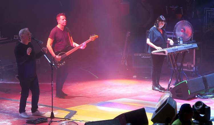 New Order are the most famous band performing today, with three Macclesfield members. Bernard Sumner, Tom Chapman and Gillian Morris are pictured in this photo. (CC - CC 2.0 bit.ly/3GQkzHU Unchanged RL GNZLZ)