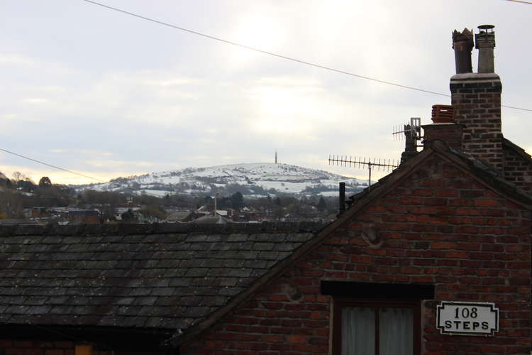 A snowcapped view beyond the 108 Steps house in Macclesfield.