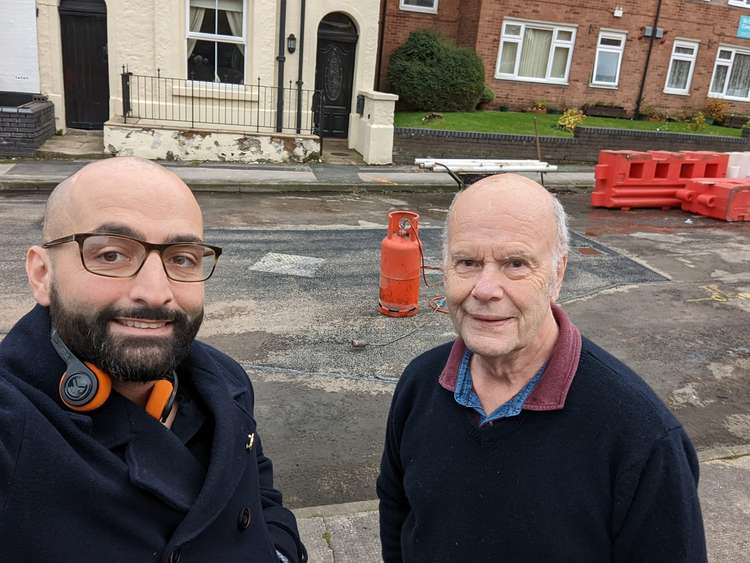 Road is reopened: Ashley Farrall poses with resident Ronnie Biggar.