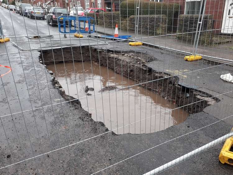 The infamous sinkhole when it first appeared on Hobson Street.