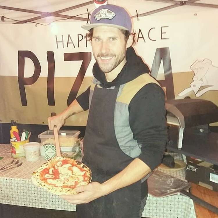 Tommy of Bollington's Happy Place Pizza, pictured with a fresh Neapolitan pizza. (Image - Happy Place Pizza)