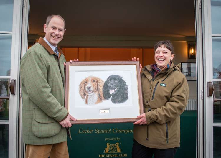 Prince Edward with Nina and her artwork, who was asked to draw dog Field Trial Championship competitors at the 2022 Cocker Championships, one of which won! (Image - Nigel Kirby Photography)