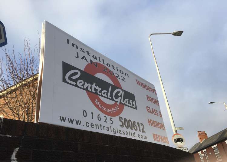 A Central Glass Macclesfield advertisement sign on the Hibel Road end of Beech Lane.