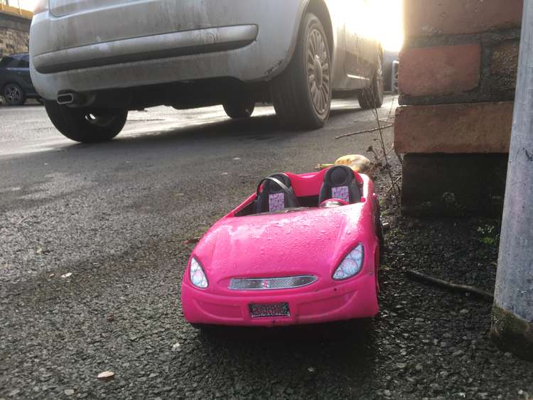 A Barbie soft top car toy with the registration place 'BARBIE' has been dumped in a Macclesfield carpark, to the humour of some locals.