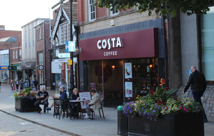 An open Costa Coffee pictured in the glistening sun of Market Place. (Image - Alexander Greensmith)