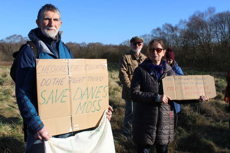 Campaigners held placards during their gathering at the site which could have 950 new homes.