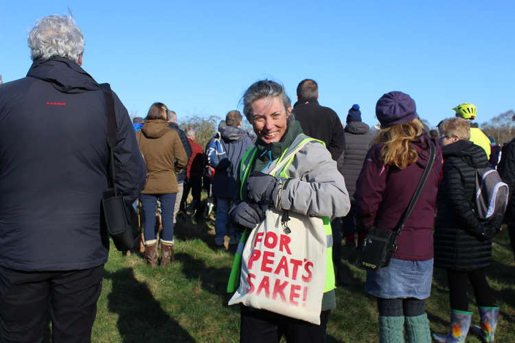 Campaigner and Macclesfield resident Ruth posing with a peat-themed tote bag.