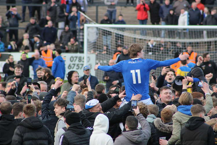 ELEVENTH HEAVEN: James Berry was hoisted into the air by Silkmen fans after the full-time whistle, seconds before he scored The Silkmen's fourth and final goal.