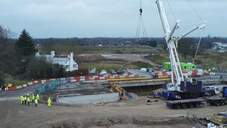 Work begun in October 2020, and now the final bridge beam is in place.