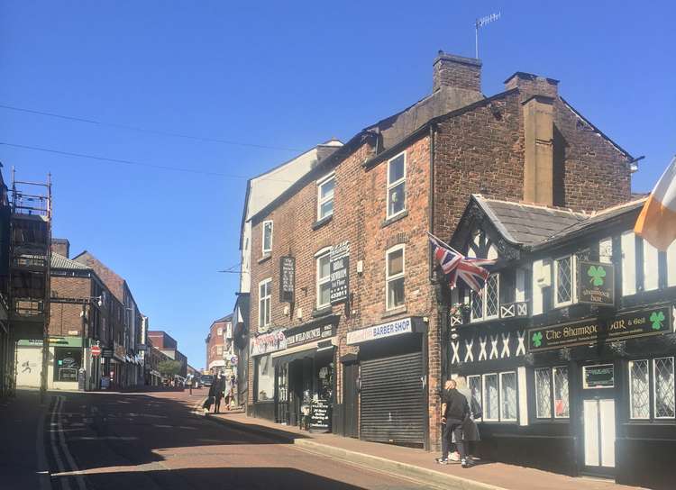 Macclesfield: Businesses on Mill Street.