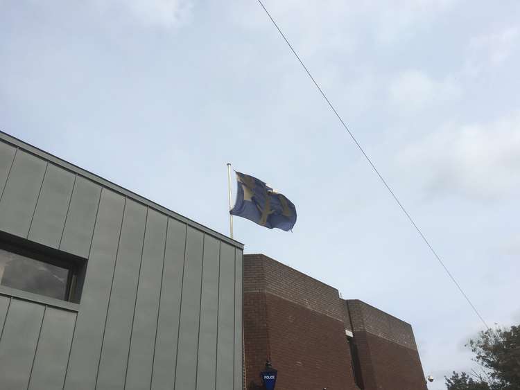 The Cheshire flag flies atop Macclesfield Police Station on Brunswick Street.