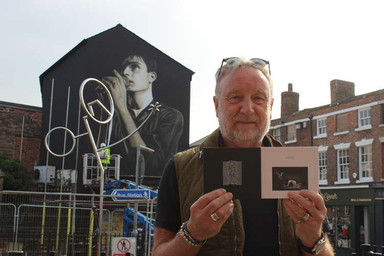 Peter Hook (right) holds together the two albums he and his Joy Division bandmates made with Macclesfield's Ian Curtis (mural).