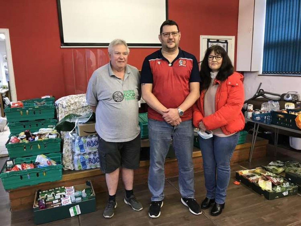 Tony Williams (centre) organised Maldon & Tiptree FC's festive food bank collection