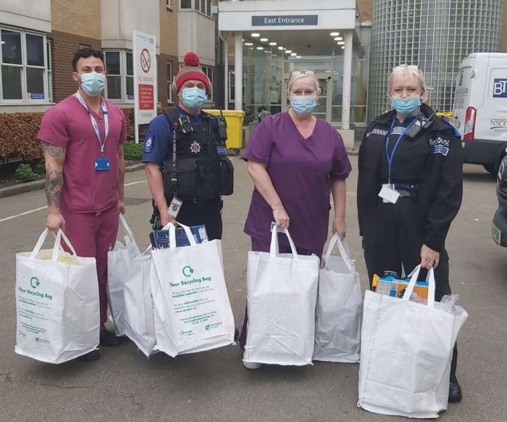 NHS staff and Maldon officers carrying the donations into children at Broomfield Hospital (Photo: Essex Police)