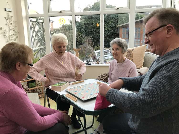Howard and the scrabble group, which meets every week